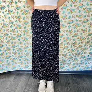 Es • se vintage 90s black floral midi skirt.